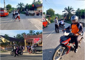 Tampak Kapos Lantas Barumun Tengah Aiptu M Sidabutar mengatur lalulintas dalam kegiatan PAM Padat Pagi di sekolah. (Foto: LimaSisiNews/Gabriel)